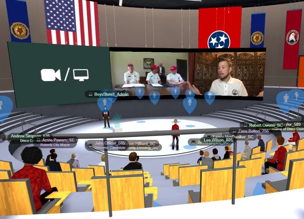 Virtual auditorium session in MootUp by Hyperspace during the Tennessee Boys State hybrid event, with avatars seated in tiered rows watching a large screen showing live video of remote participants.